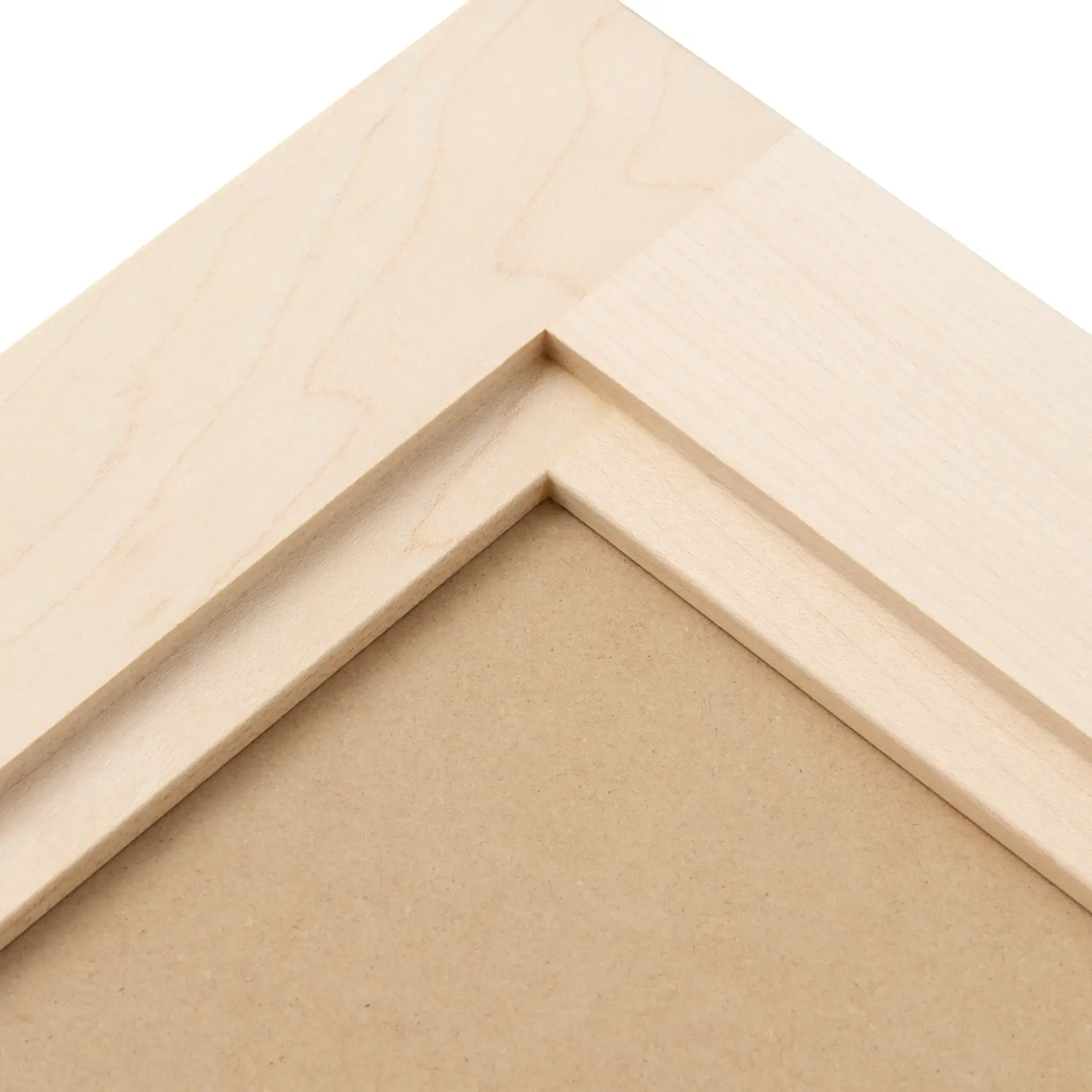 Two-step inner-edge profile at the corner of an unfinished door frame